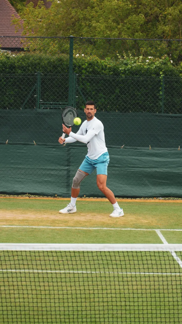 Novak Djokovic practising on a back court