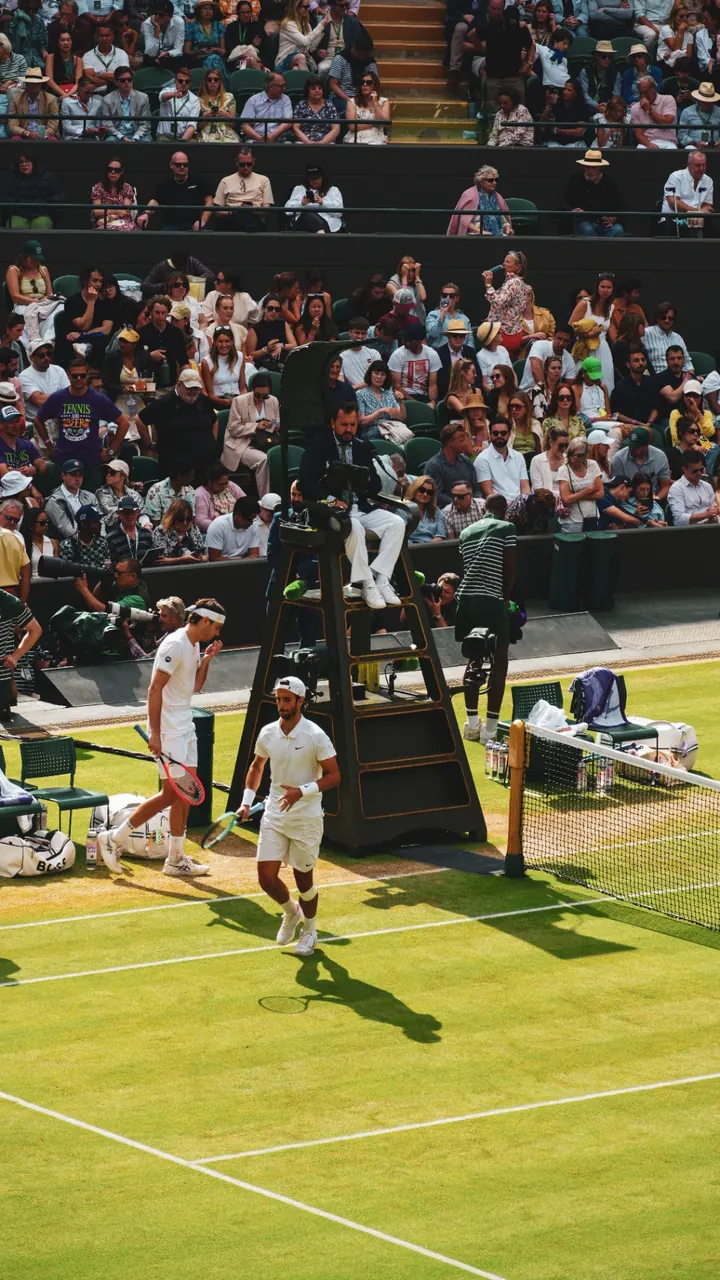 Players changing ends beneath the umpire's chair