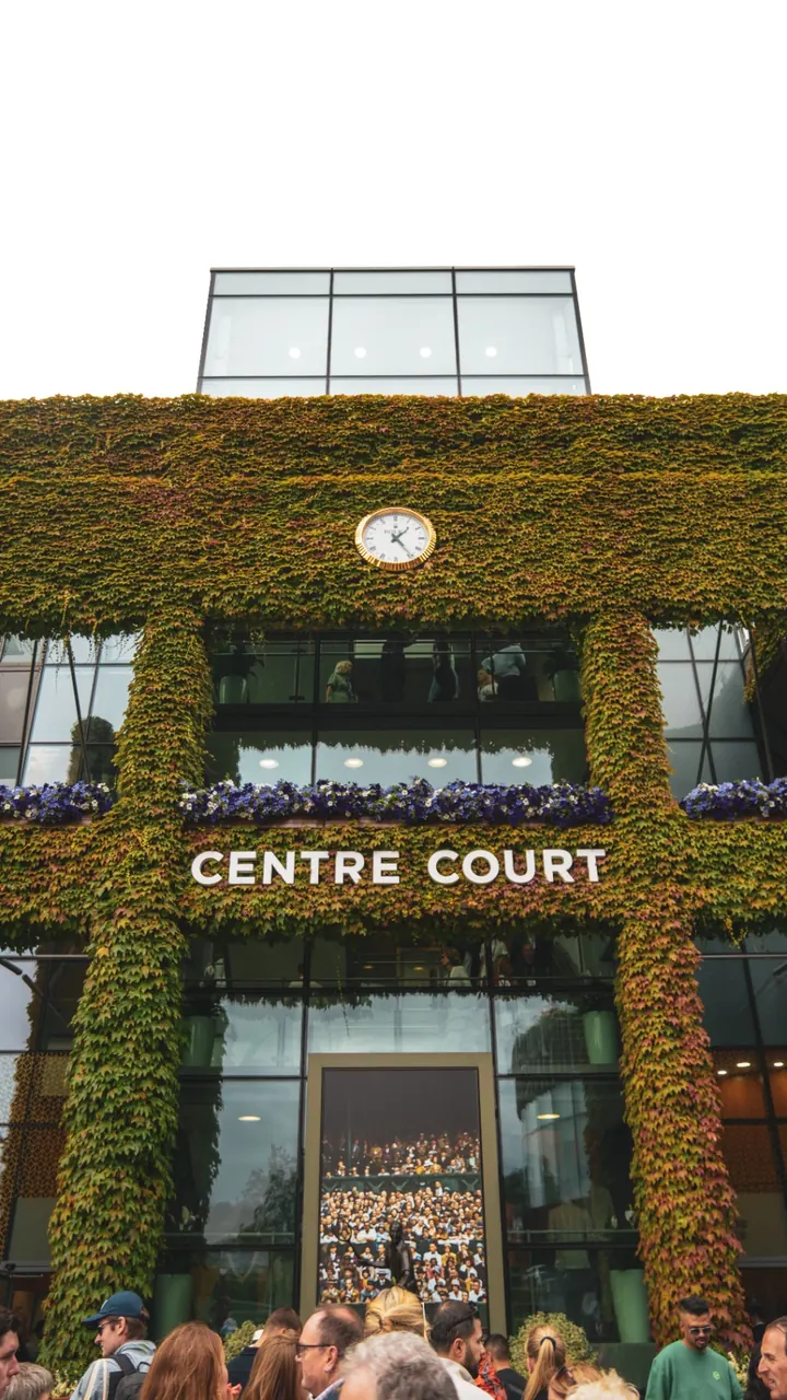 Centre Court ivy-clad facade with Rolex clock